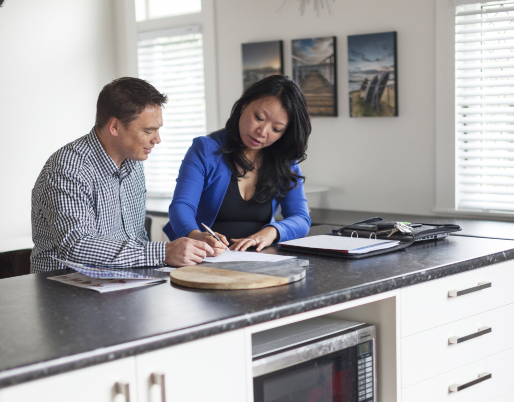 Real Estate agent signing papers